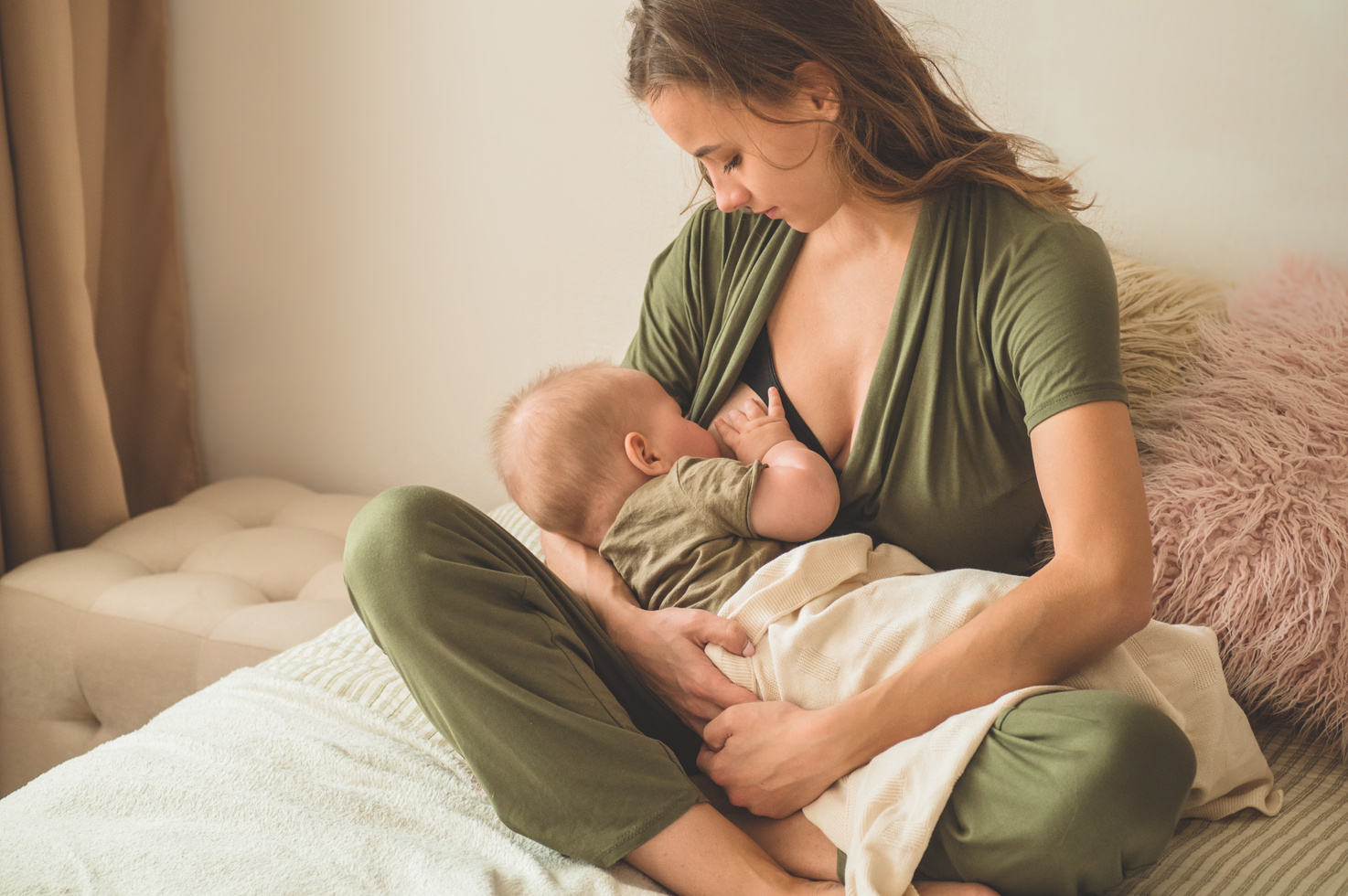 Portrait of mom and breastfeeding baby.